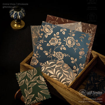 Vintage floral patterned cardstock with gold foil accents in a wooden box