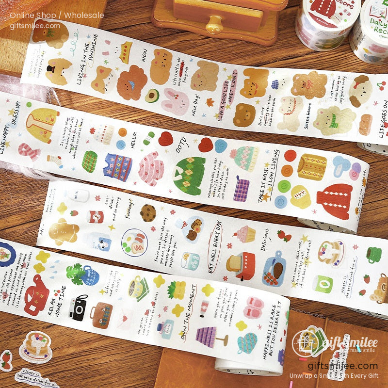 Colorful decorative sticker rolls with playful illustrations of food sweaters and animals on a wooden surface