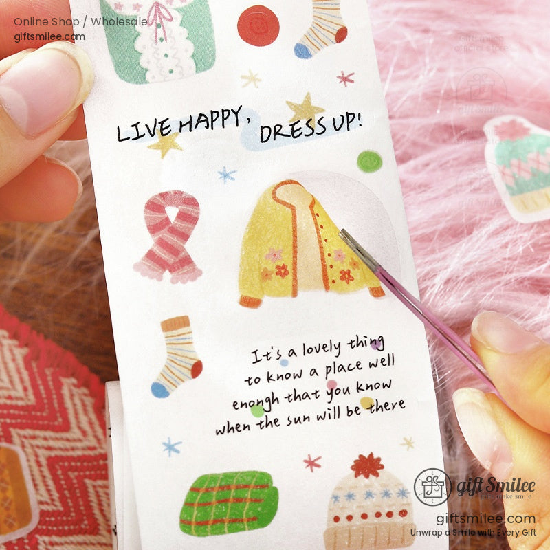 Decorative sticker roll with colorful winterthemed designs including a yellow coat pink scarf and knitted hats