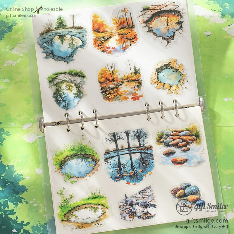 Collection of Path of Puddles watercolor stickers displayed in a binder