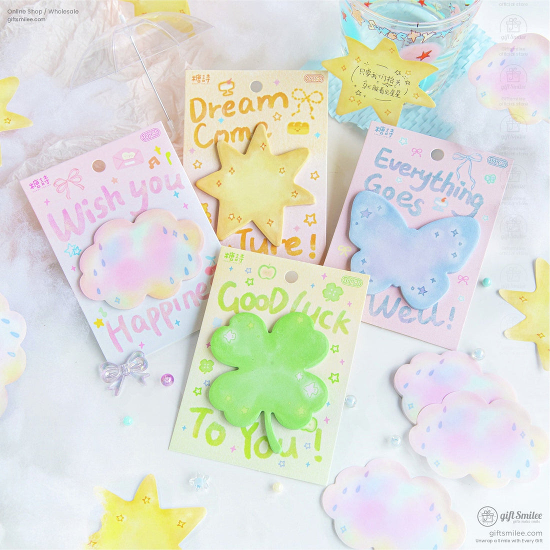 Dreamy pastel sticky notes featuring star, clover, cloud, and butterfly shapes in soft hues on a fluffy cloud background