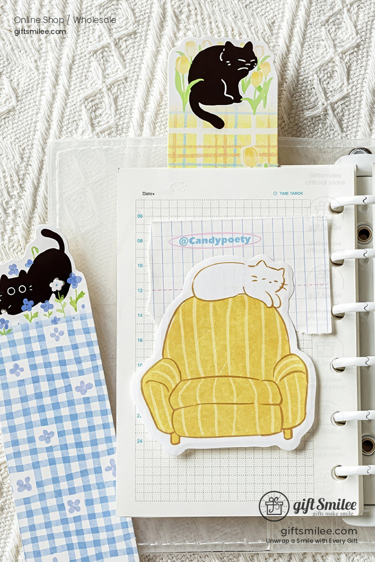 Cute black cat illustrated bookmarks on open book and cozy blanket, floral and plaid designs – Giftsmilee Meow Flower Book collection.