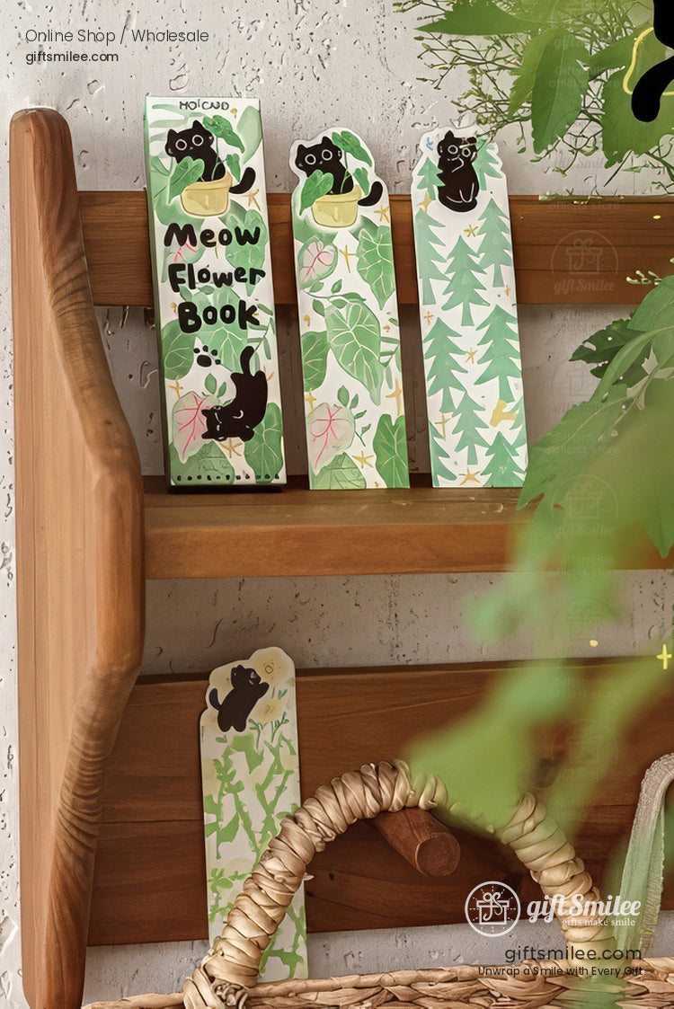 Cute black cat bookmark set on open book and blanket, floral and plaid designs