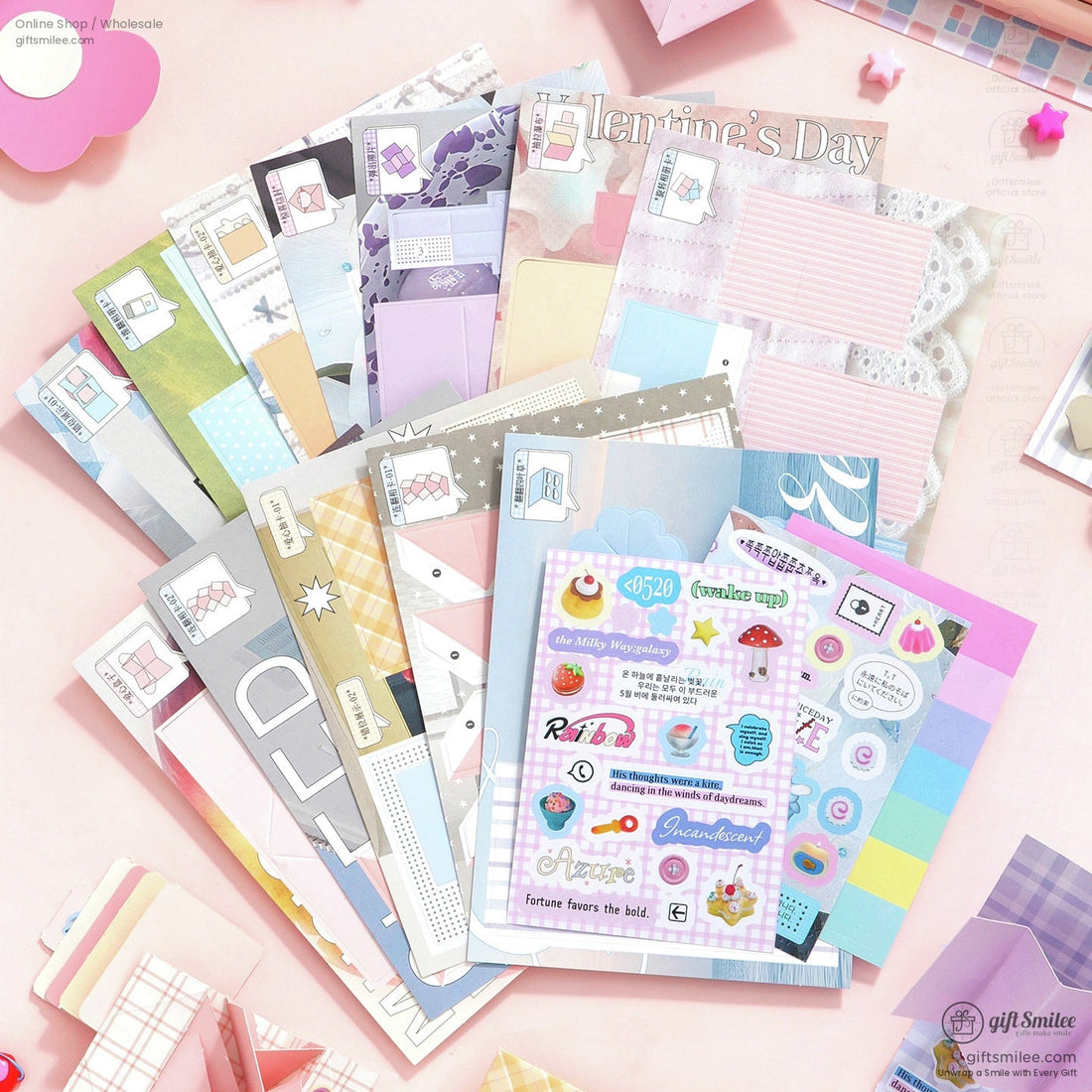 Colorful DIY scrapbook kit with stickers, papers, and envelopes laid out on a desk  