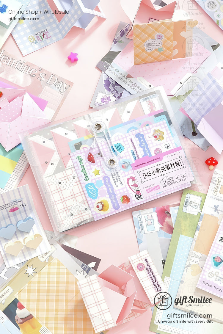 DIY scrapbook kit with pink pop‑up photo frame and stickers being placed in a binder  