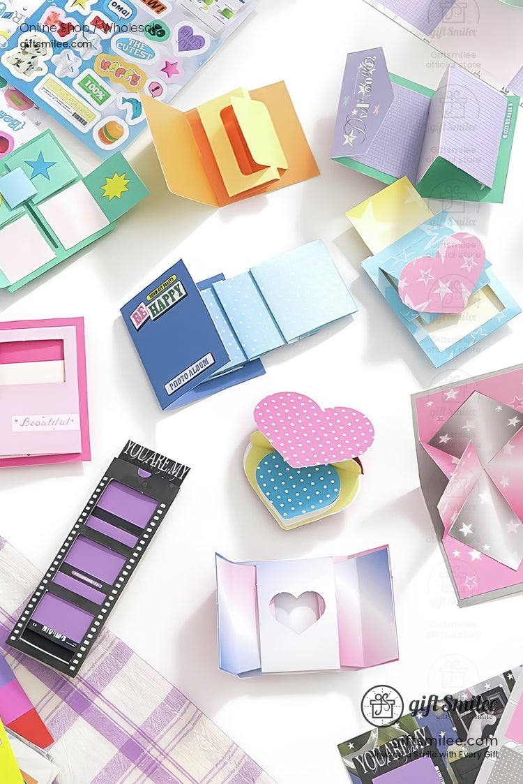 Colorful DIY pop-up greeting card kit with heart and star designs, scrapbooking stickers, and foldable templates laid out flat.