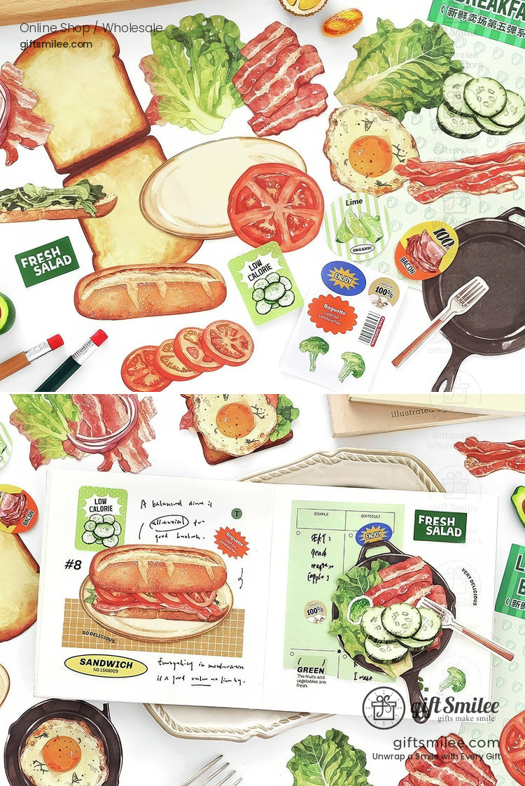 Food-themed scrapbook stickers with bread, desserts, and drinks arranged around an open journal.