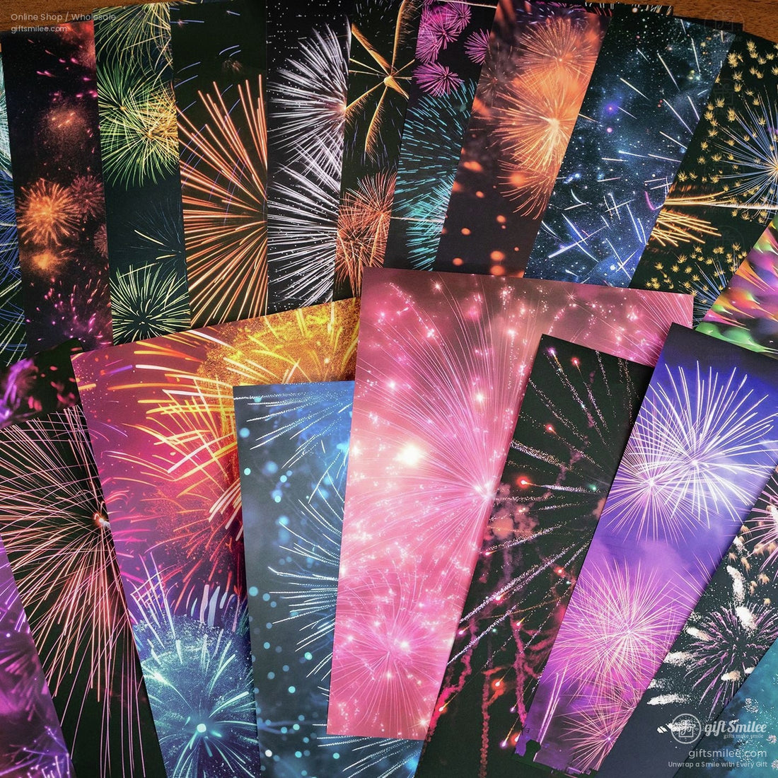 Fireworks-themed wrapping paper sheets showing matte and glossy finishes held by hand  