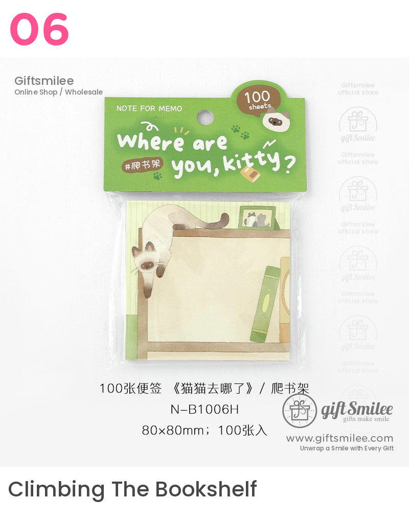 Green memo pad with playful Siamese cat illustration on bookshelf 100 sheets 80x80mm size light beige and green tones