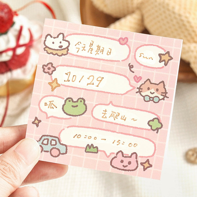 Pink gridpatterned notepad with handdrawn animal doodles speech bubbles stars and playful gold date details