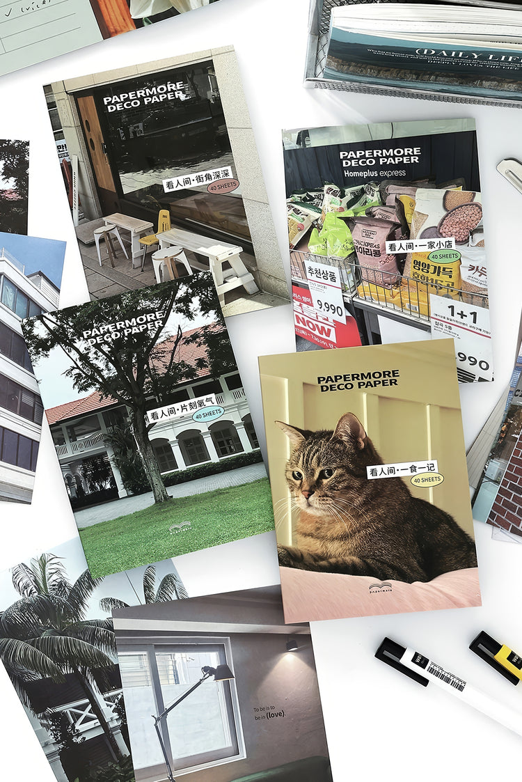 Assorted Papermore decorative paper sheets with realistic prints of homes cats and daily scenes in vibrant colors