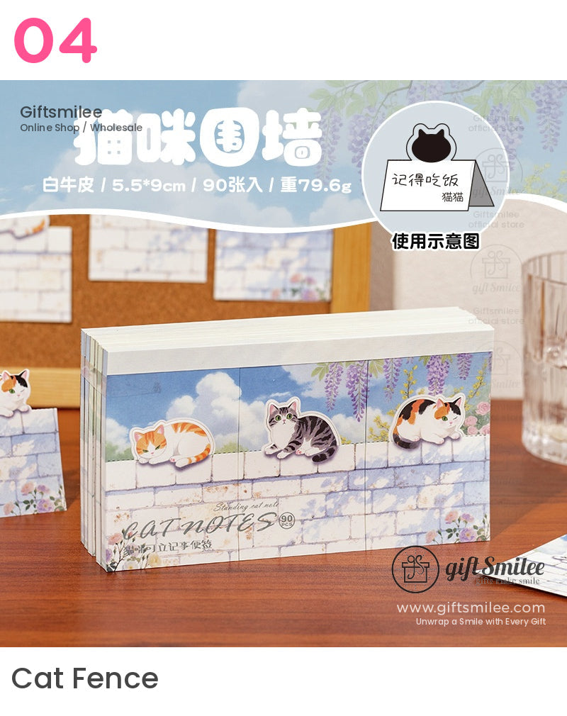 Stack of catthemed sticky notes with pastel blue brick wall design floral accents and three illustrated cat prints