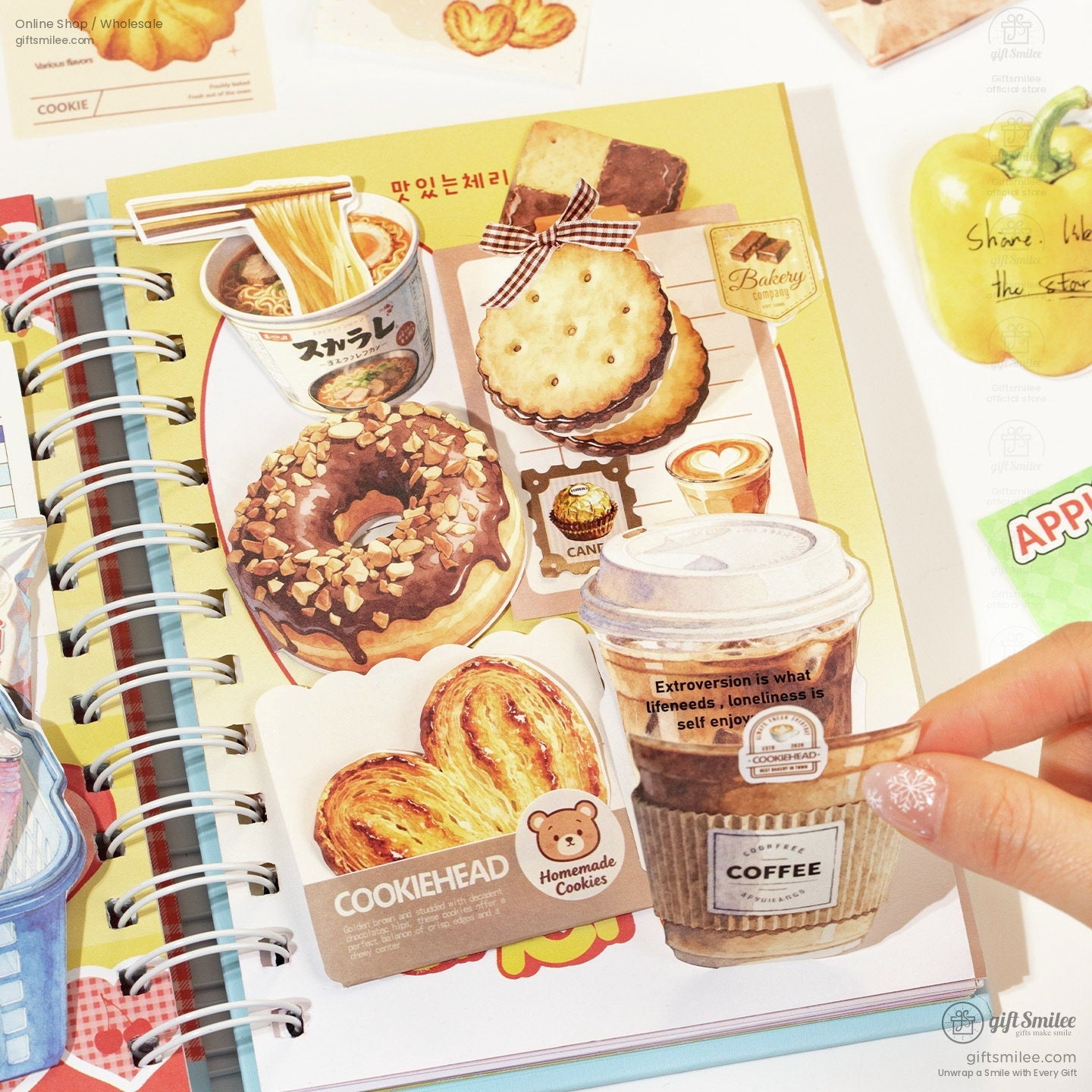 Whimsical foodthemed stickers including a chocolate donut croissant coffee cup and biscuits on a spiral notebook