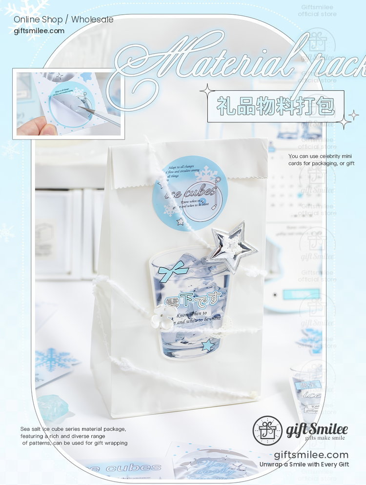 White gift bag with light blue circular label silver star charm and clear snowflake accents ideal for elegant packaging