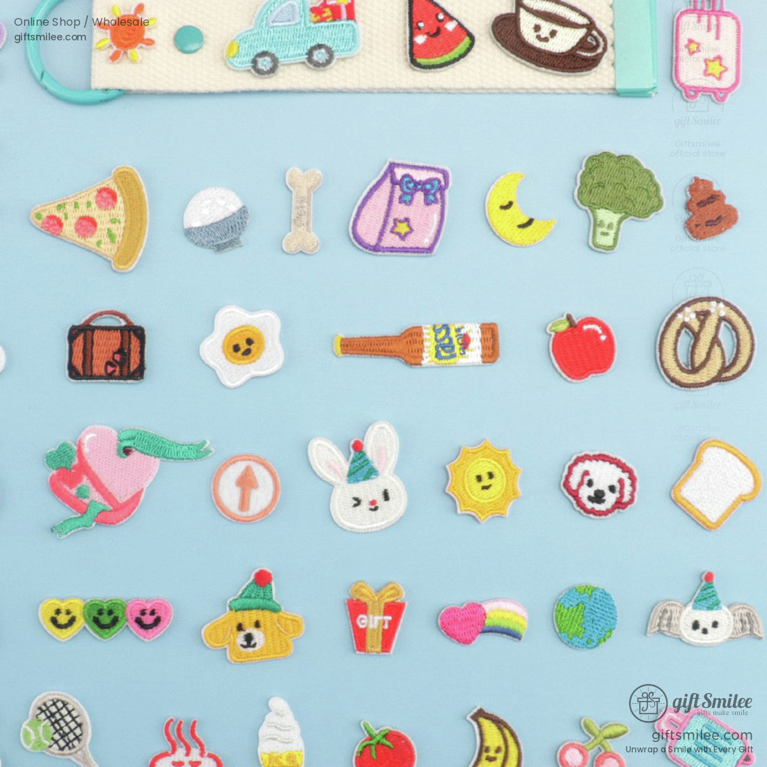 Colorful embroidered ironon patches featuring food animals and objects on a light blue background