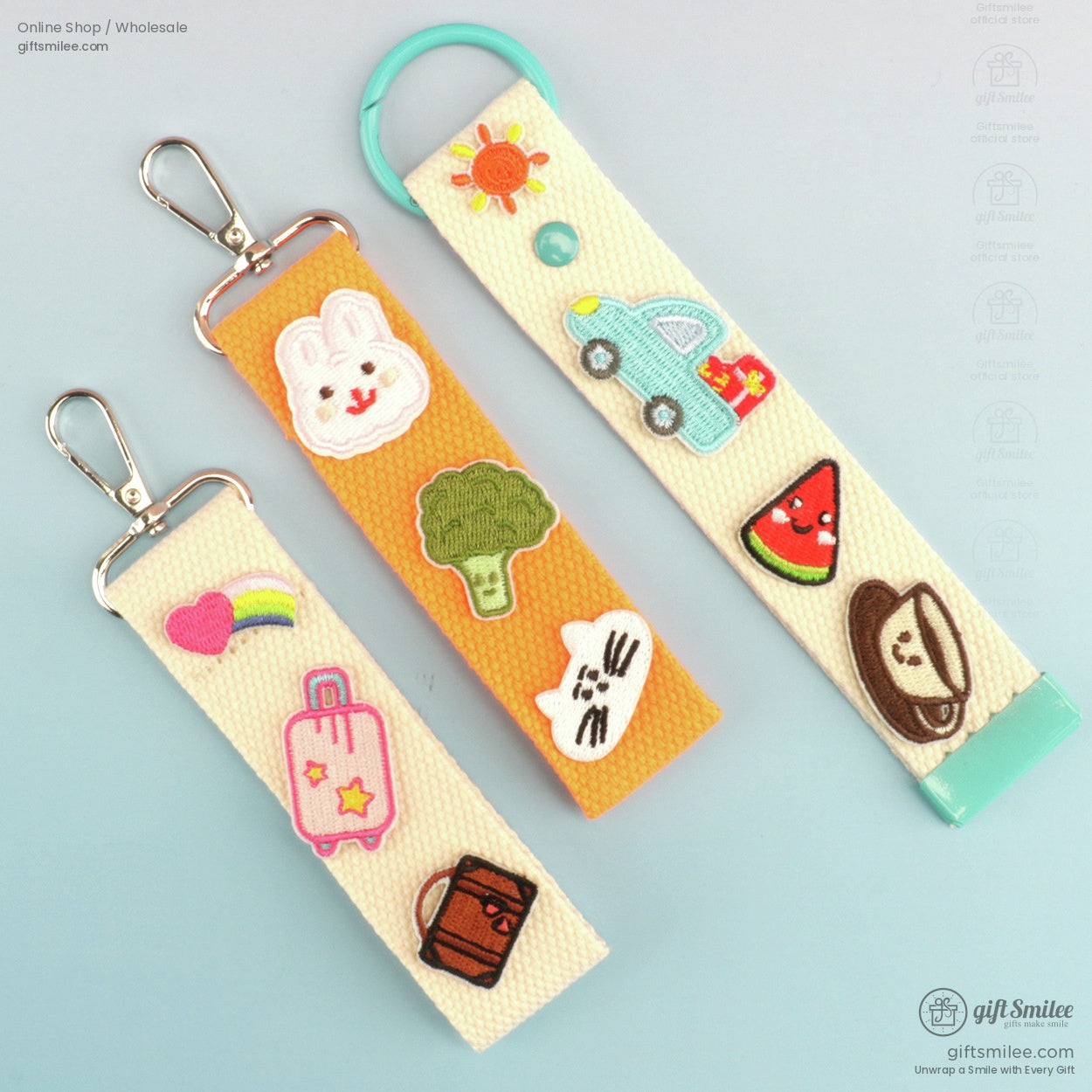 Set of embroidered canvas keychains with colorful designs including rabbit car watermelon and rainbow motifs