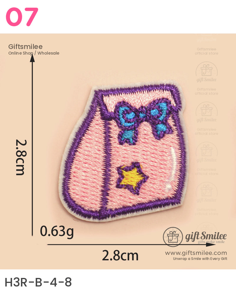 Pink embroidered patch with purple border blue bow detail and yellow star accent measuring 28cm by 28cm