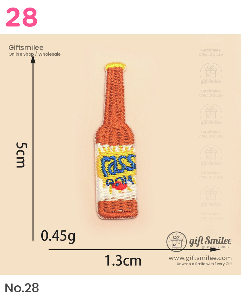 Orange embroidered beer bottle patch with yellow and blue Cass logo measuring 5cm x 13cm lightweight fabric design