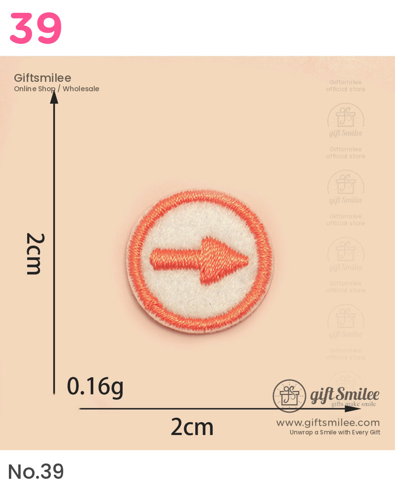 Round embroidered patch with orange arrow on white background bordered by orange stitching 2cm in diameter
