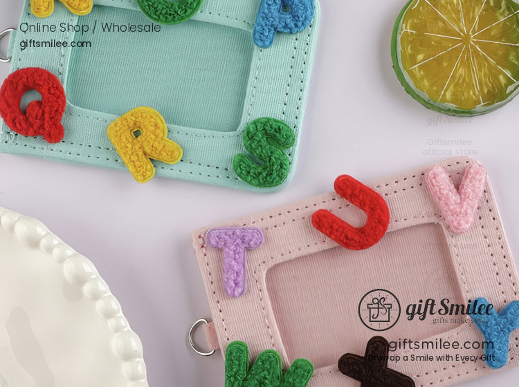 Pastel pink and mint green ID card holders with colorful 3D alphabet embroidery and metal keyring attachments