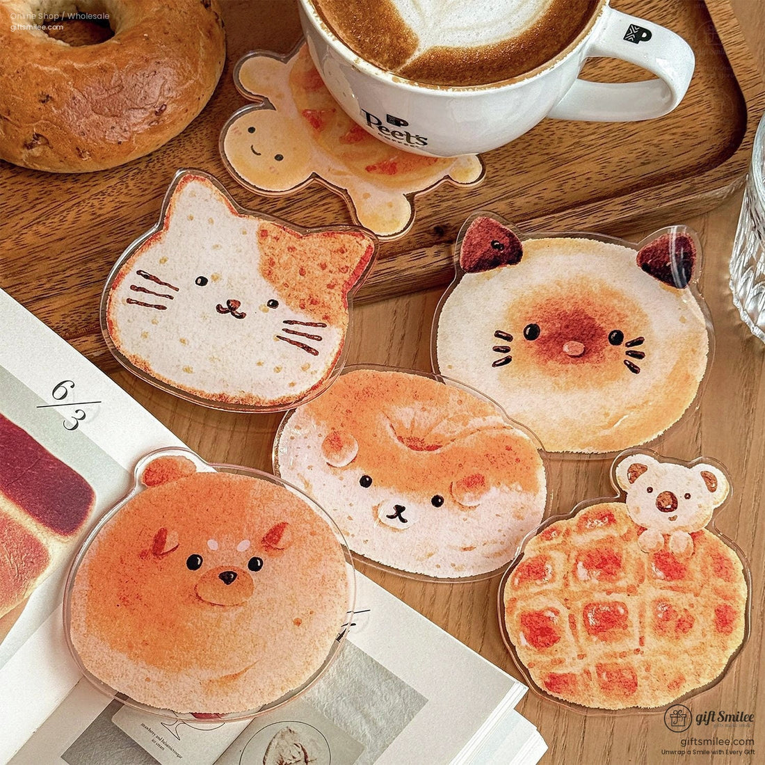 Cat-shaped bread coaster next to a latte and book