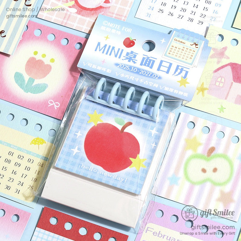 Mini desktop calendar featuring cute dessert illustrations with spiral binding for desk use