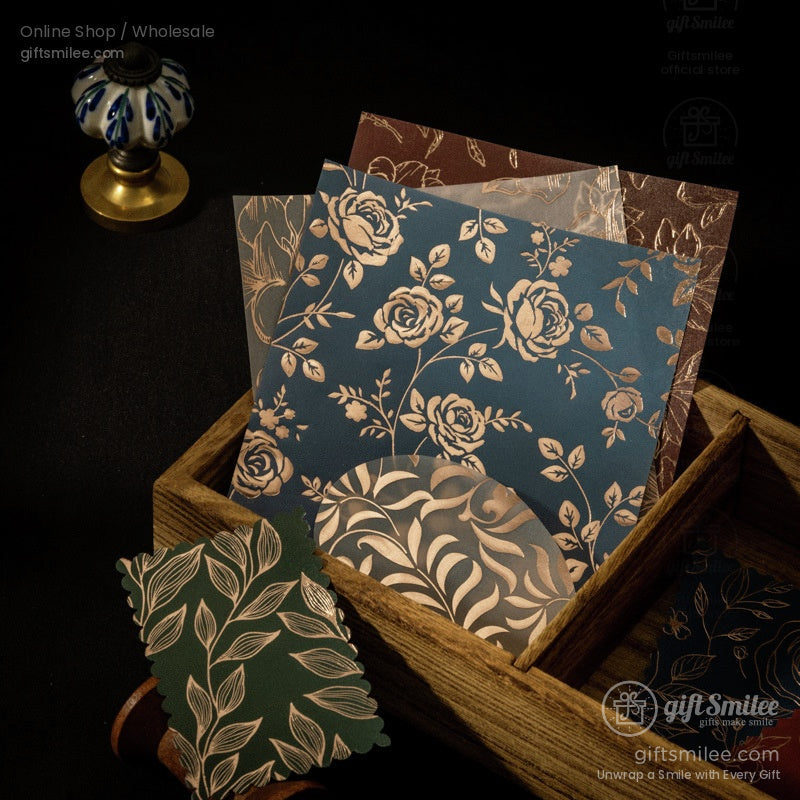 Vintage floral patterned cardstock with gold foil accents in a wooden box  