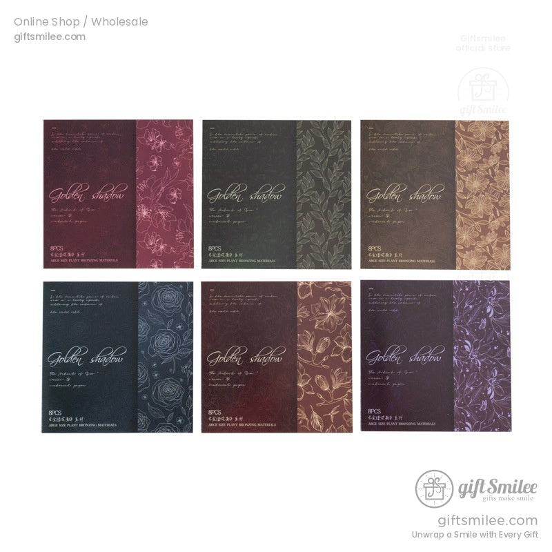 Metallic foil floral patterned cardstock sheets in vintage colors displayed in a wooden box.