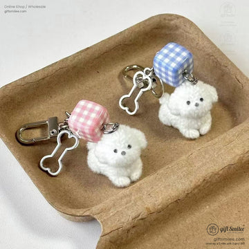 Plush white dog keychains with pink and blue gingham cube charms silver bone accents and durable metal clasps