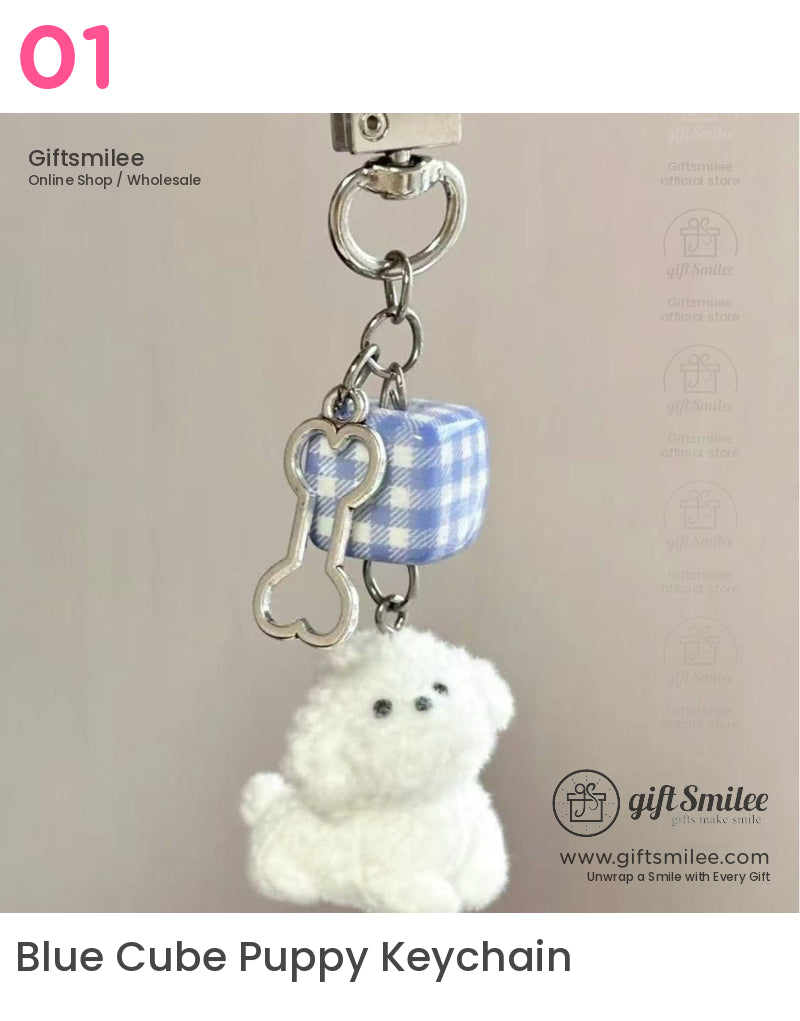 Keychain with white plush dog charm silver bone pendant and blue gingham cube on a metal ring clasp