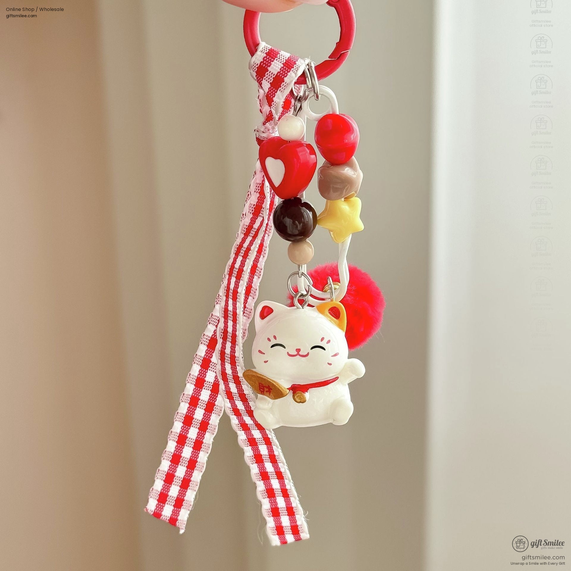 Lucky cat keychain with red gingham ribbon colorful beads red pompom and silver clasp on a red ring