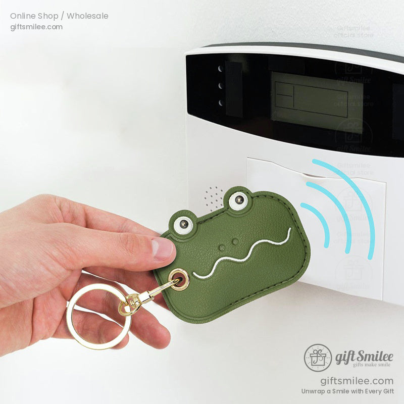 Green leather frogshaped keychain with gold ring whimsical design featuring white accents and RFID functionality
