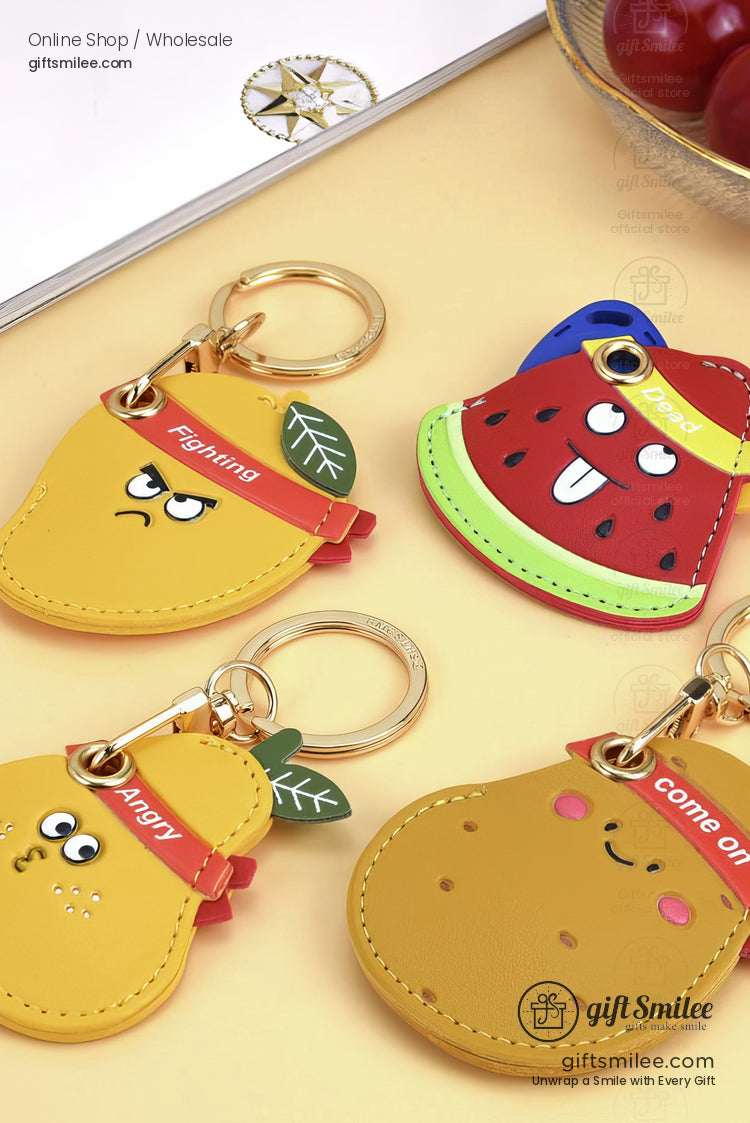 Colorful fruit and vegetableshaped keychains with playful expressions gold keyrings and vibrant red and yellow accents