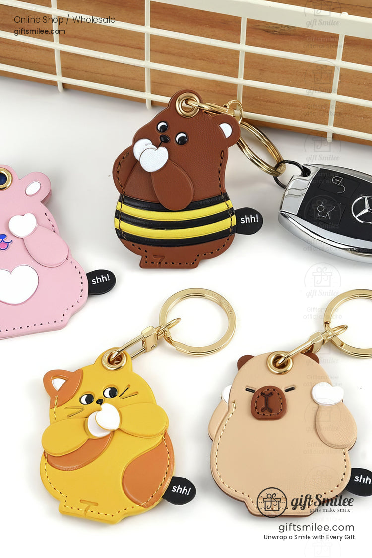 Cute animalshaped leather keychains in pink brown yellow and beige with gold rings and playful cartoon designs