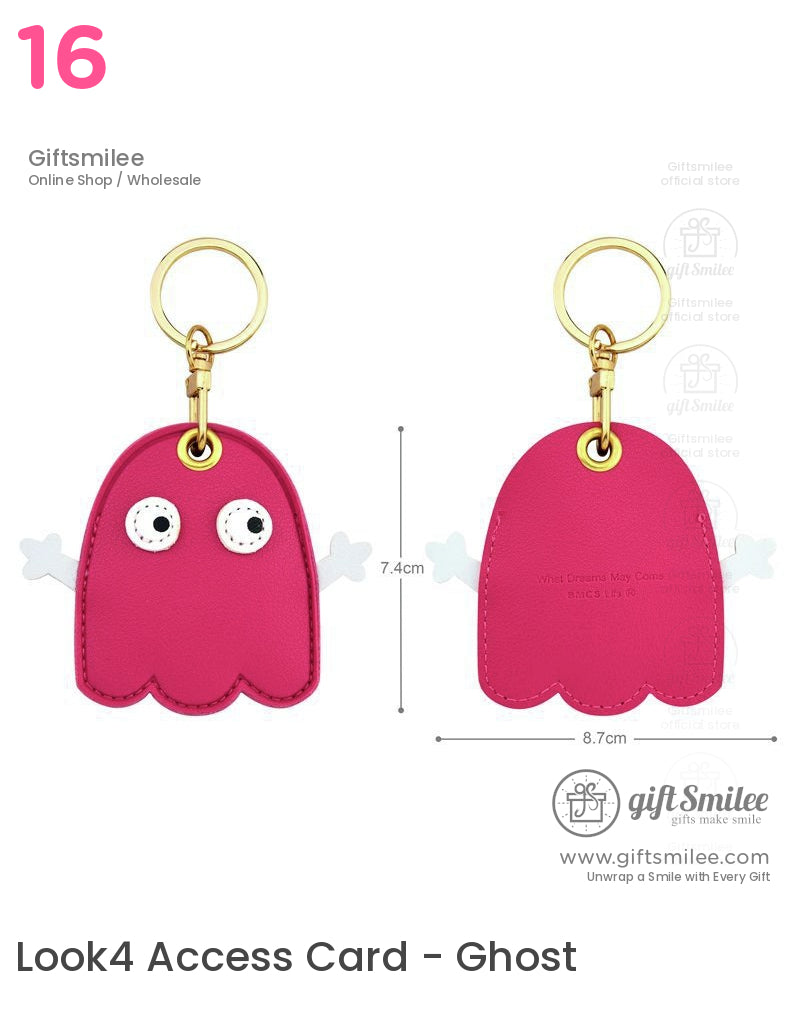 Pink leather ghostshaped keychain with white cartoon eyes gold metal ring and playful arm accents 74x87 cm