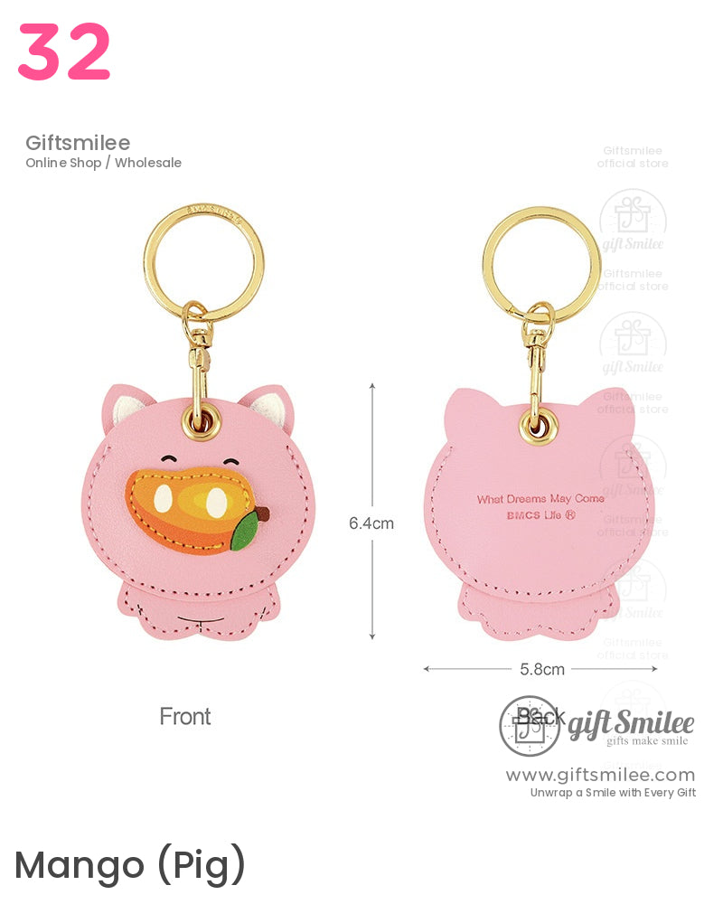 Pink pigshaped faux leather keychain with mango motif goldtoned ring stitched details and engraved back text
