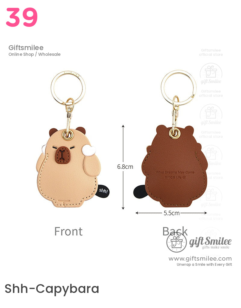 Beige and brown leather bearshaped keychain with gold ring fine stitching embossed details and playful shh tag