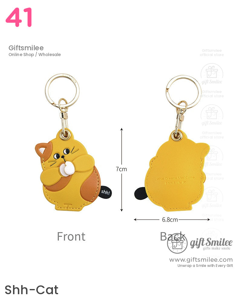 Yellow and orange catshaped PU leather keychain with a goldtone ring cartoon design and Shh detail