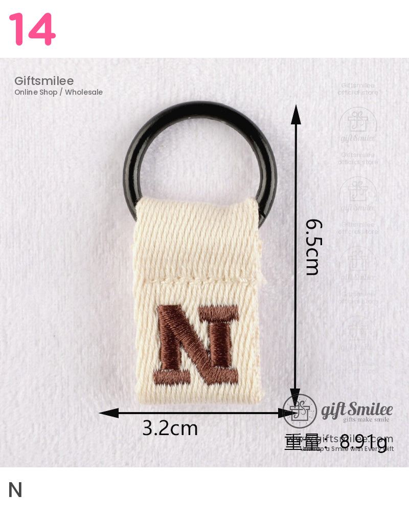 Cream cotton keychain with black metal ring embroidered brown N design measuring 65cm by 32cm lightweight