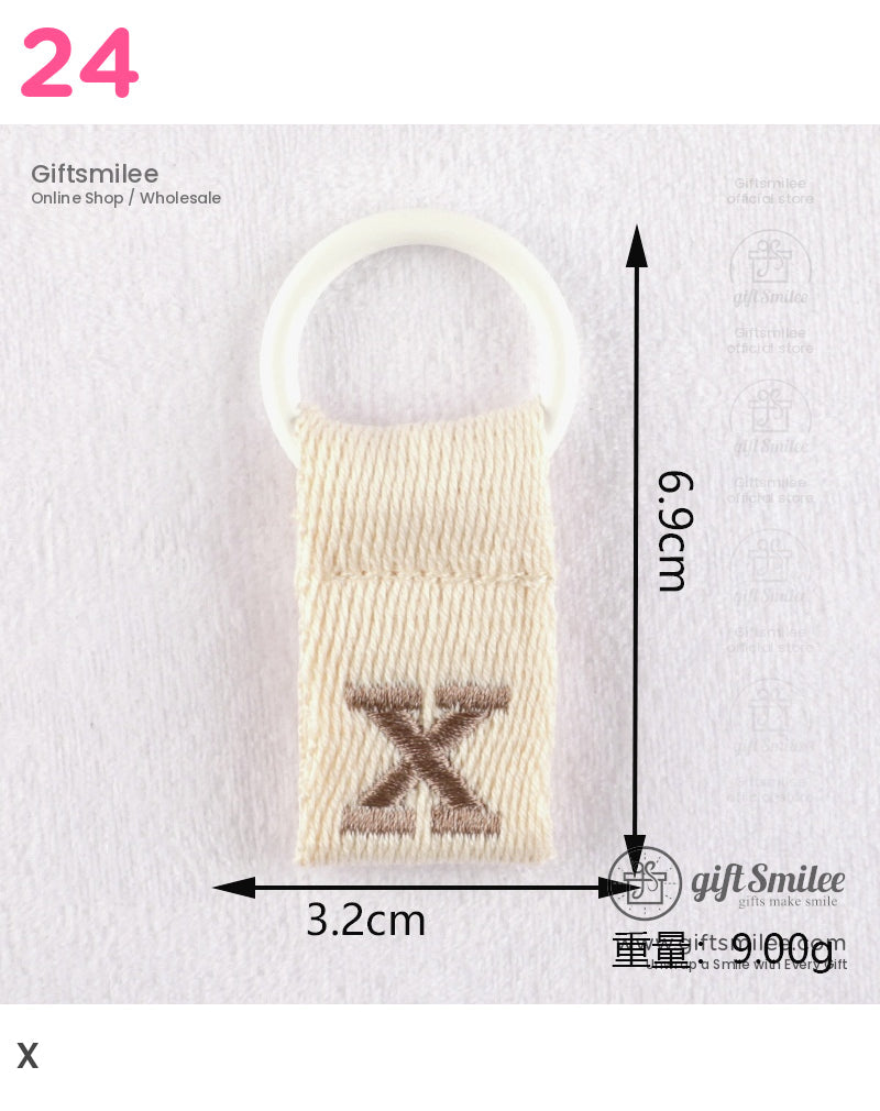 Beige woven fabric keyring with white plastic loop stitched brown X design dimensions 69cm by 32cm