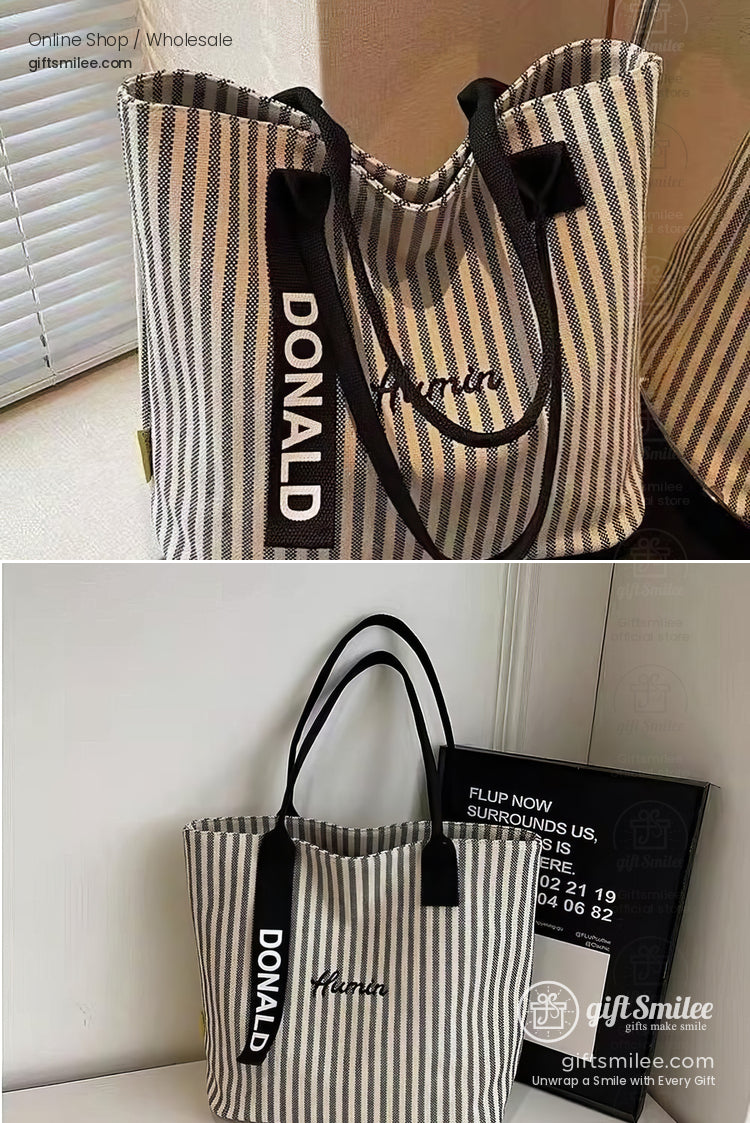 Beige and white striped canvas tote bag with black handles Donald and Marnie text casual and spacious design