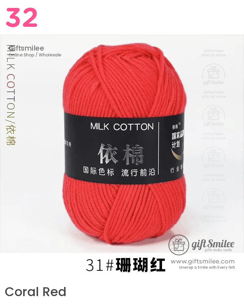 Bright red milk cotton yarn with soft texture tightly wound skein and black label featuring bold silver text