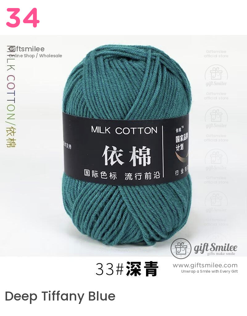 Deep teal milk cotton yarn soft texture suitable for knitting and crochet neatly wound into a skein