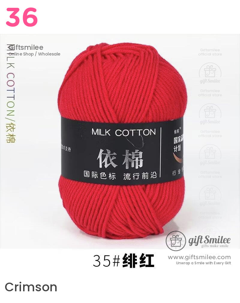Bright red milk cotton yarn ball with smooth texture dense strands and a black label featuring white Chinese text