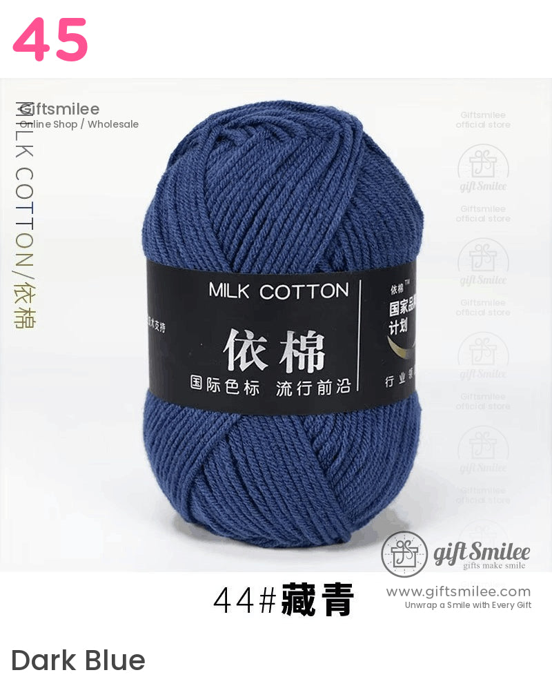 Deep blue milk cotton yarn skein with a soft texture labeled in black and white perfect for knitting projects