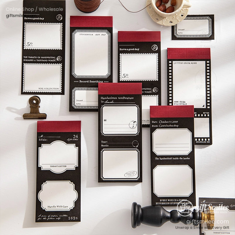 Vintage-style black and red sticky notes and memo pads set for journaling and scrapbooking on desk flat lay