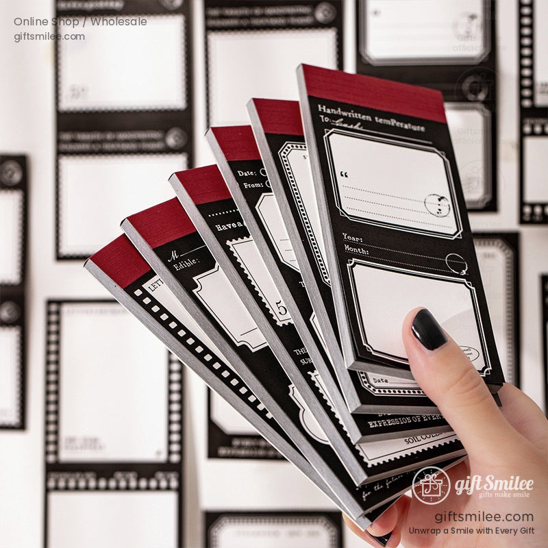 Vintage-style black and red sticky notes and memo pads set for journaling and scrapbooking on desk flat lay