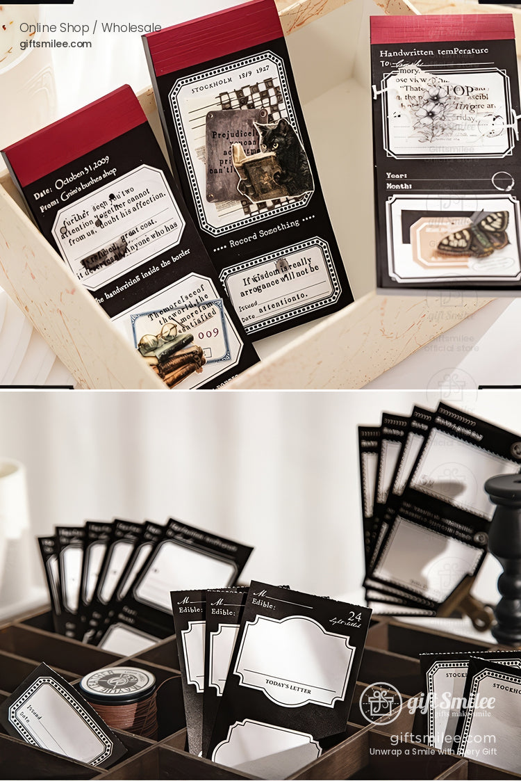 Vintage-style black stationery label stickers and memo pads displayed in a wooden tray for scrapbooking and gifting.