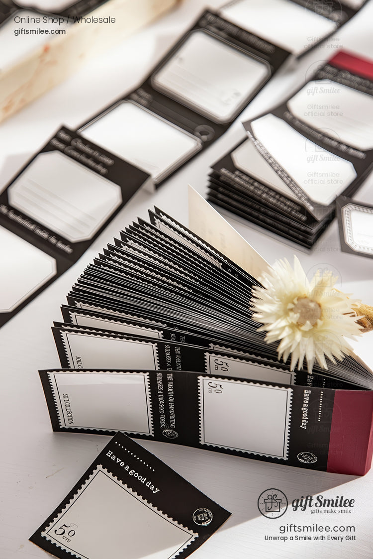 Black and white vintage-style adhesive label stickers for gifts and packaging displayed on a table from giftsmilee.com
