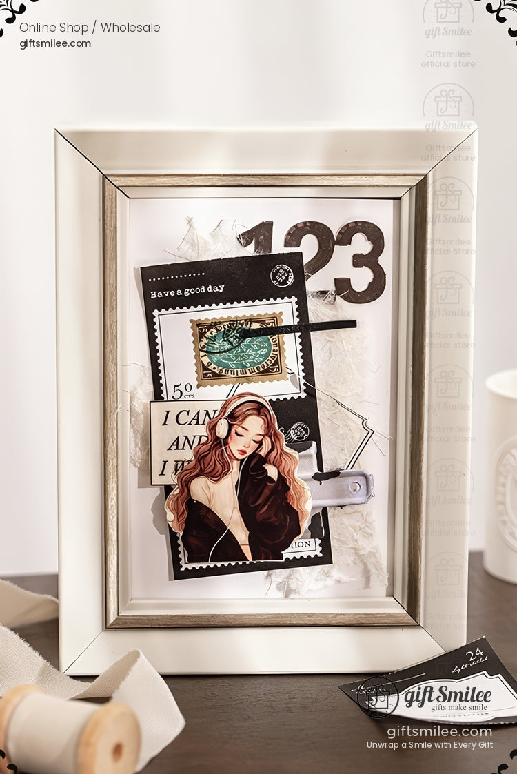 Silver picture frame displaying layered vintage collage art with stamps, numbers, and illustrated woman on a white background.